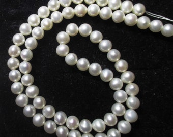 Freshwater cultured pearls - 16 inch strand of 5 millimeter round pearls - 18 - 22 grams