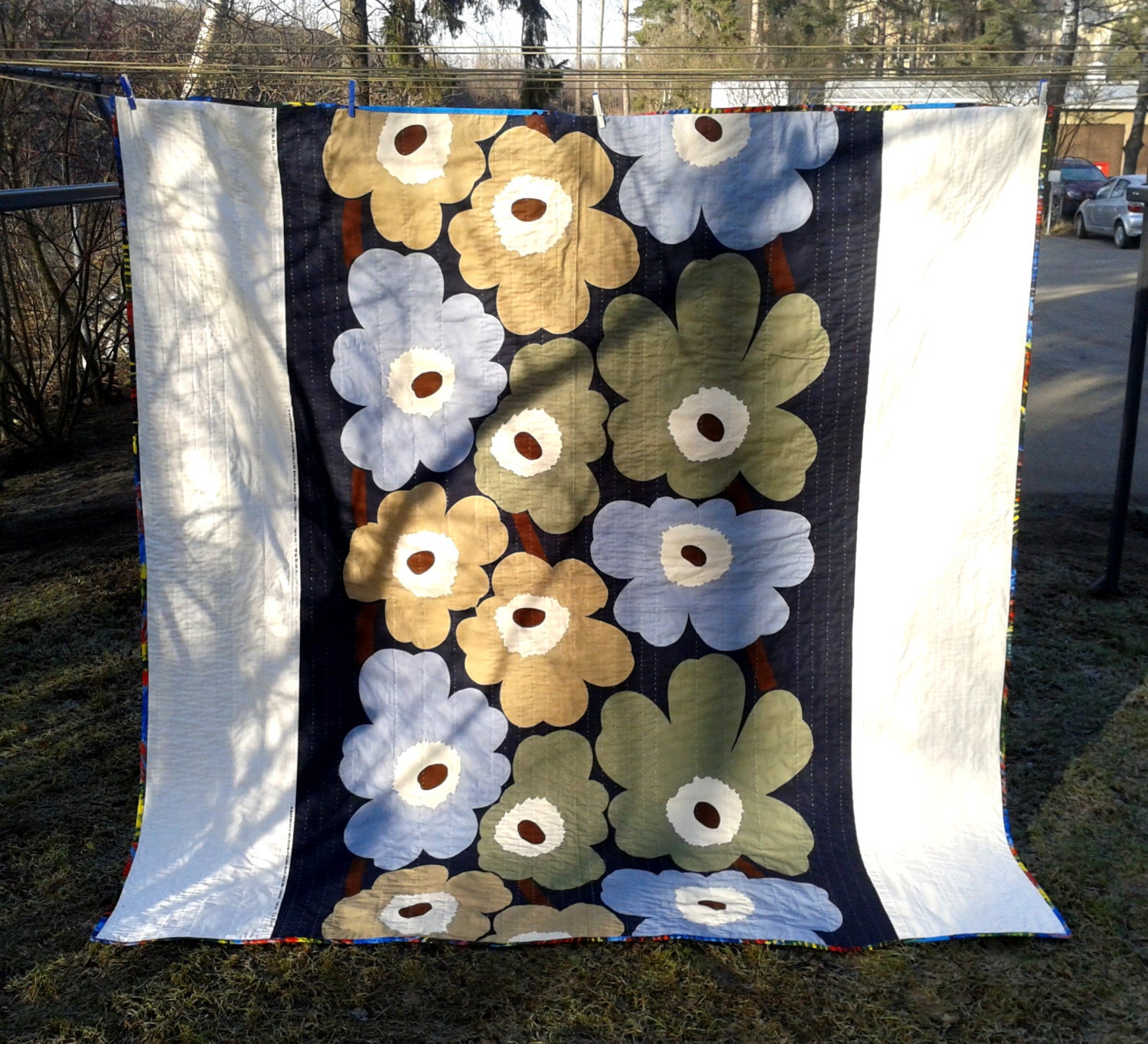 Modern quilt made from Marimekko fabric patchwork geometric