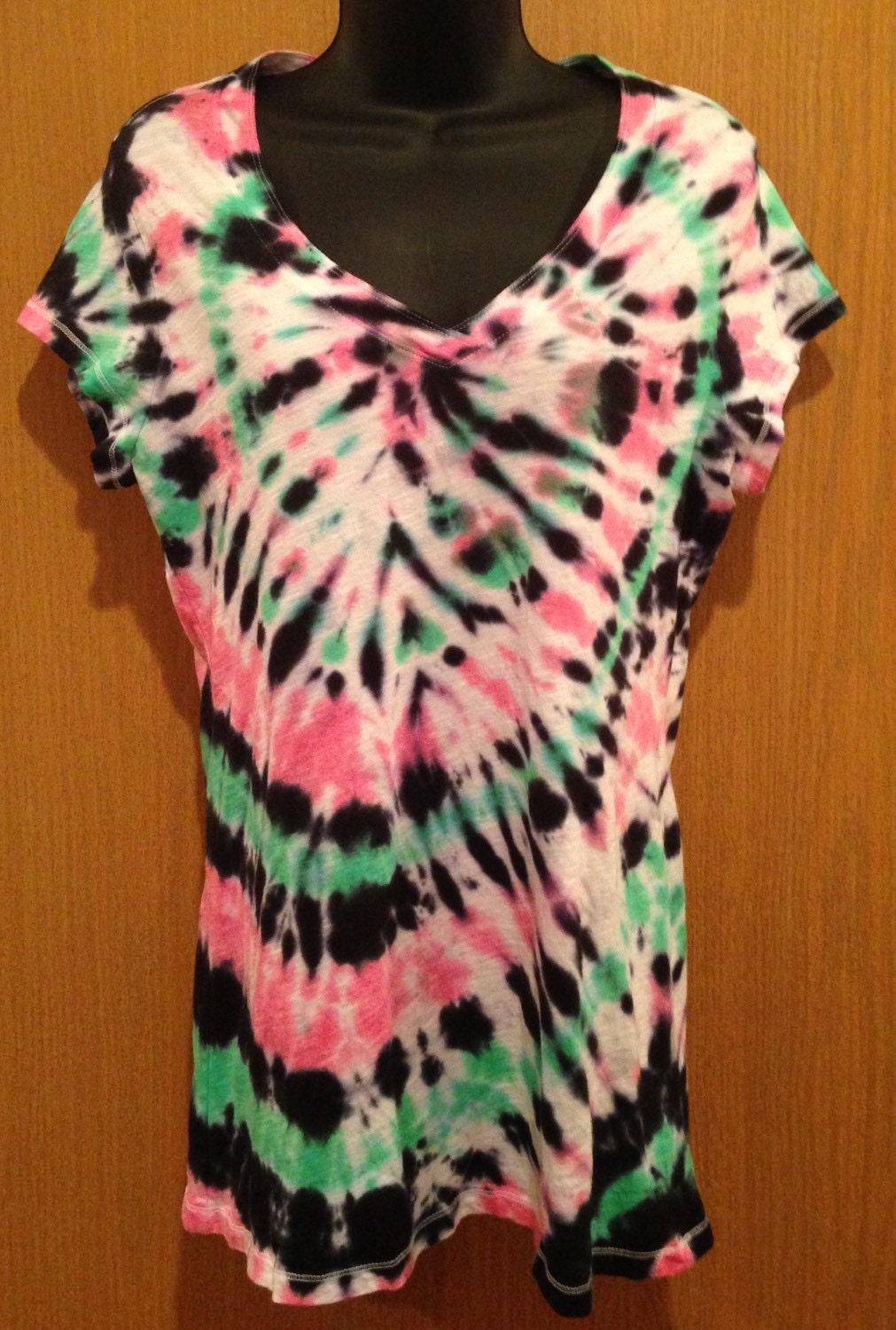 green and pink tie dye shirt