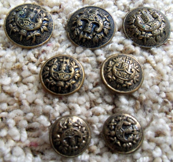 Vintage Set of 7 Antique Metal Buttons JTE Crest and Axe 3