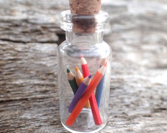 Miniature color pencils in a little bottle