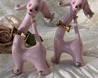 vintage pink porcelain poodles