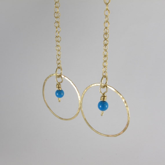 Long gold dangle hoop earrings Long gold dangle hoop earrings