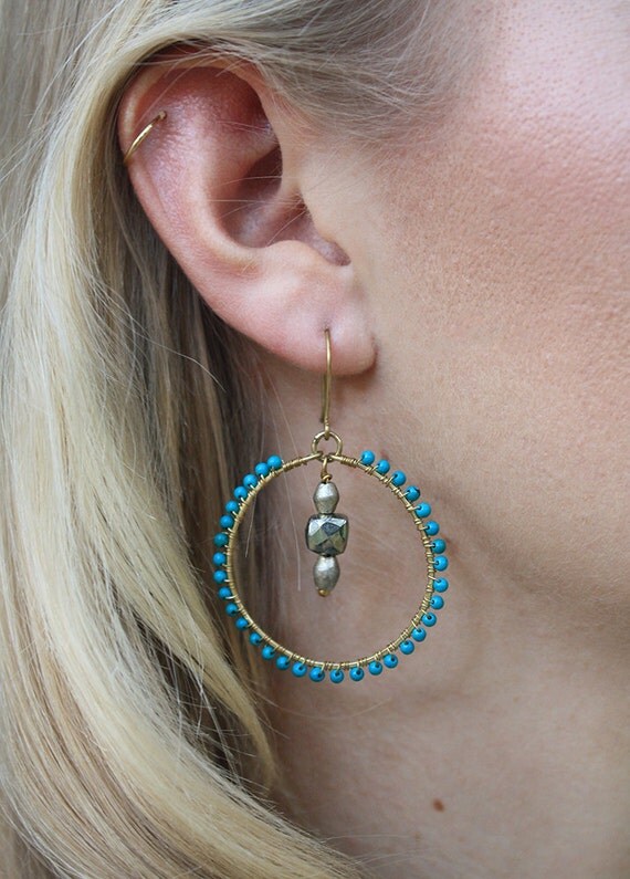 Items similar to Unique wire wrapped hoop earrings with turquoise beads