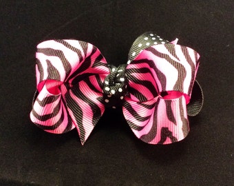 Items similar to Small Zebra Print Boutique Bow on Etsy