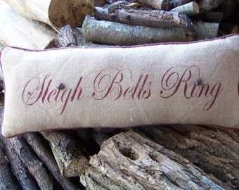 Holiday hand stenciled burlap pillow with hand painted welt.
