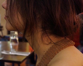 Meticulously hand knit necklace made from re-purposed scrap copper wire from Mozambique.