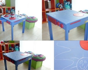 Convertible child table in the kitchenette and slate for chalk.