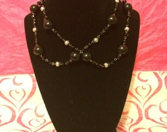 Items similar to Three-Strand Black Bead Necklace on Crocheted Wire on Etsy