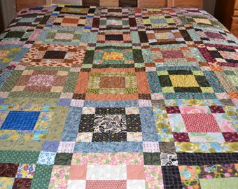 Beautiful scrappy quilt ,queen sized