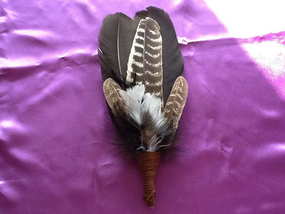 Turkey feather smudge wand with quartz crystal. 12 long