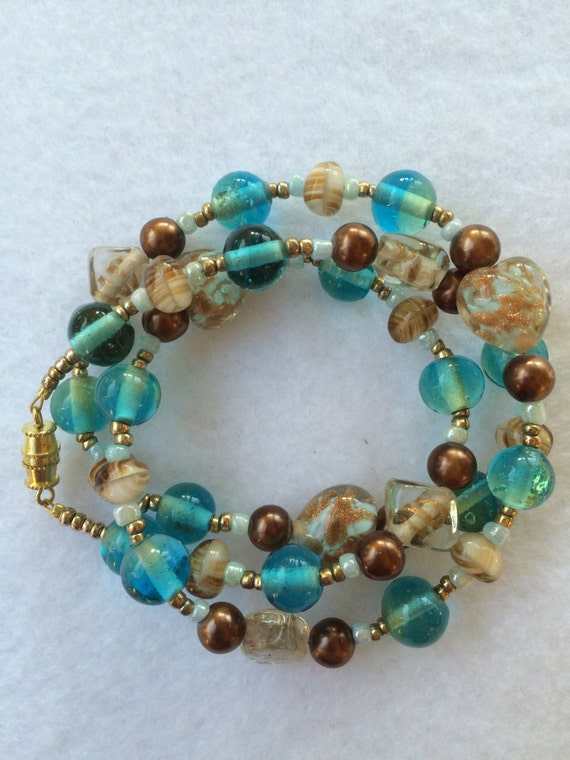 Blue and Brown Beaded Bracelet with Gold Accents and Lampwork