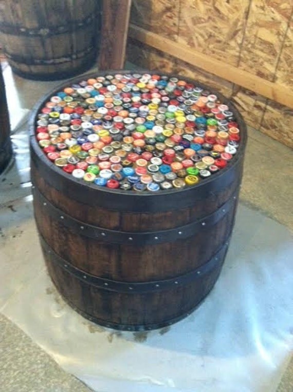 Whiskey barrel with beer caps and 32 inch glass.