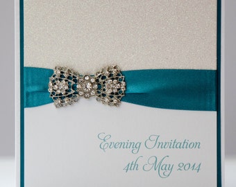 White & Teal Sparkle Art Deco Bow Wedding Invitation