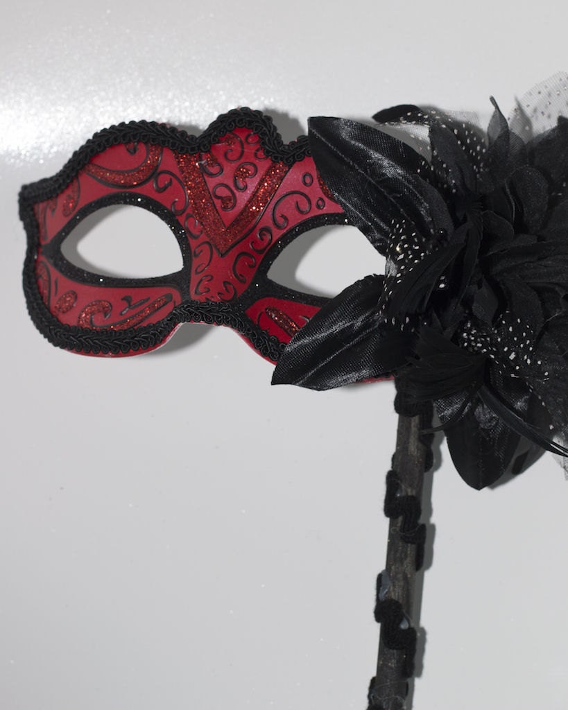 Red and Black Masquerade Mask on a Black Stick with Flower