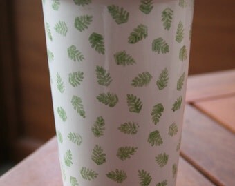 Ceramic travel mug hand decorated with green fern leaves