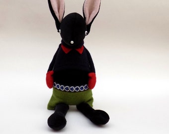 Black Velour Rabbit - Handmade plush sculpture wearing navy woollen pullover and red felt mittens.