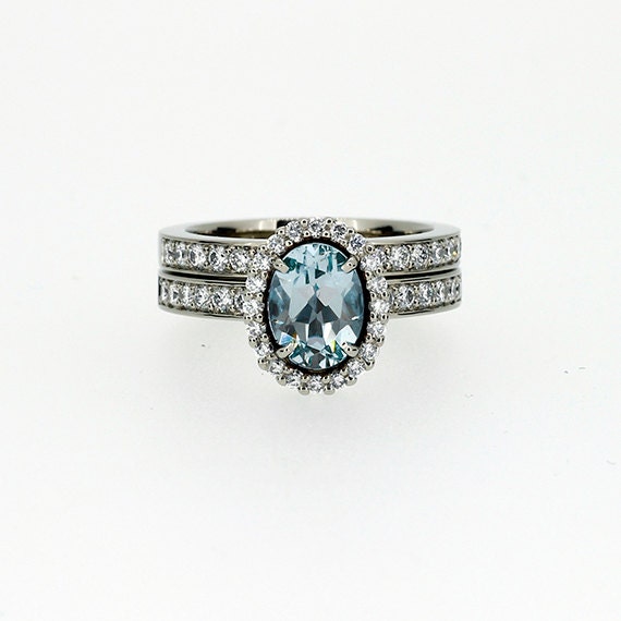 Aquamarine halo engagement ring set diamond by TorkkeliJewellery