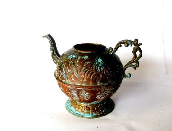 Ornate oriental verdigris copper kettle. Embossed flowers. Embossed old jerusalem scenery.  Jerusalem inscription on the base.