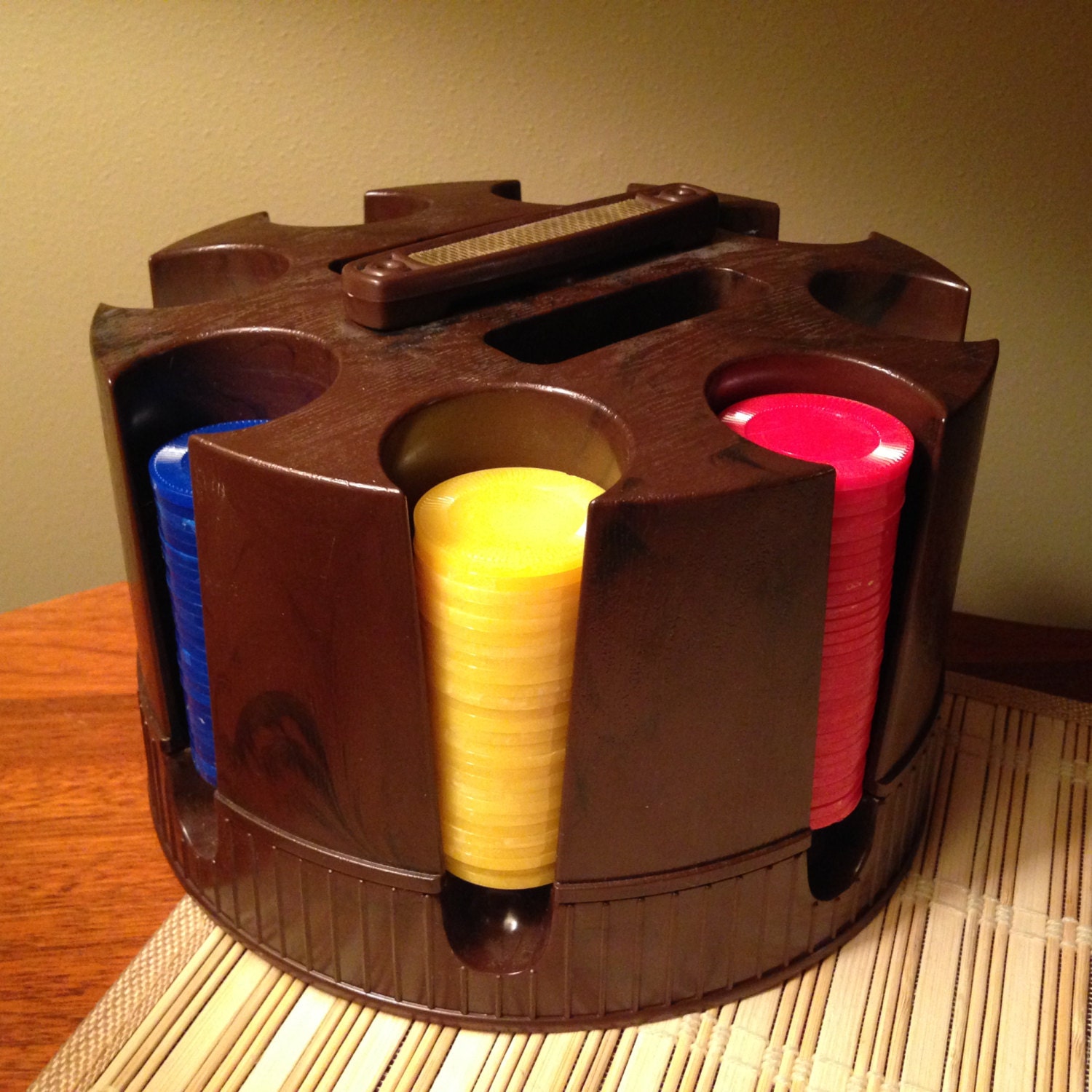 Retro poker chip caddy with various colored poker chips
