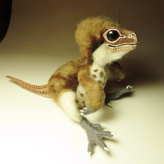 tiny raptor like dinosaur