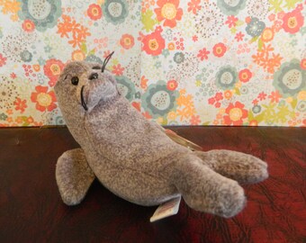 Items similar to Seal "Slippery" Baby Beanie Buddy with Pacifier on Etsy