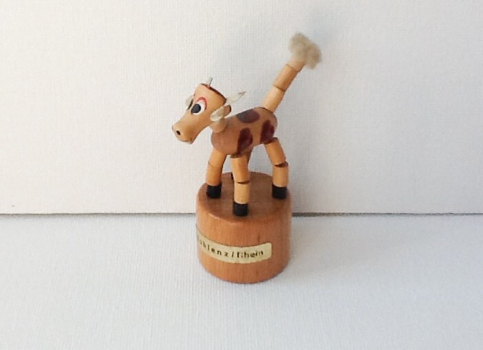 Small Vintage Wooden Push Puppet Cow Collapsible Push Up Toy
