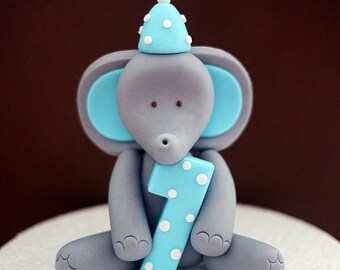 Elephant fondant cake topper. Elephant cake topper with number and party hat for birthday