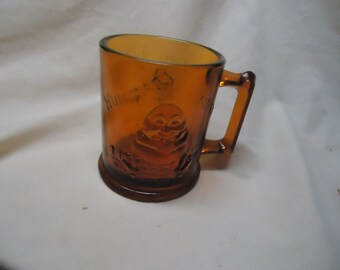 Vintage Amber "Humpty Dumpty & Tom Tom the Piper's Son Glass Mug, collectable. brown