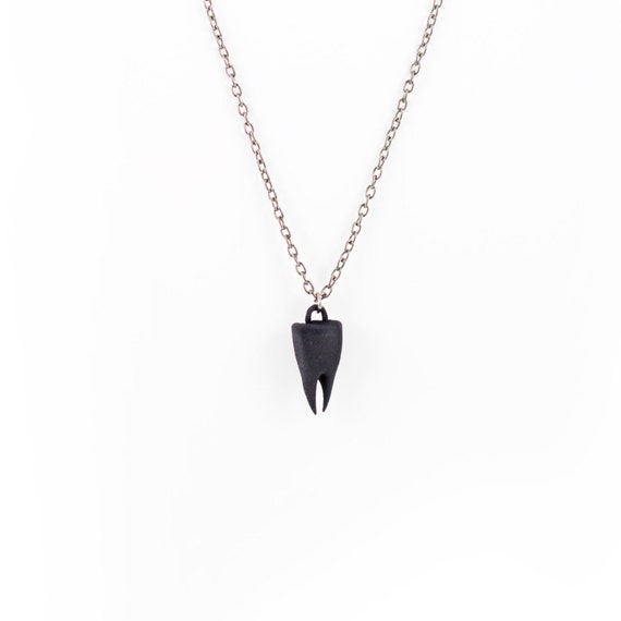 Tooth Necklace in black A black tooth by TheRogueAndTheWolf