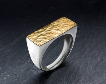 Hammered ring made from 18k gold and sterling silver. Handmade jewelry from goldsmith.