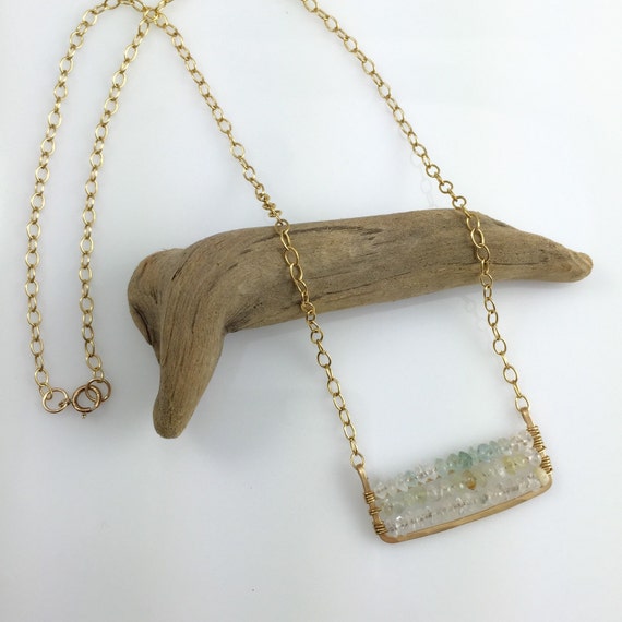 Handmade pendant woven with tiny light blue by HeidiKiddjewelry