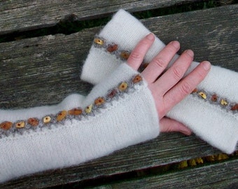Hand knitted and felted fingerless gloves for women.