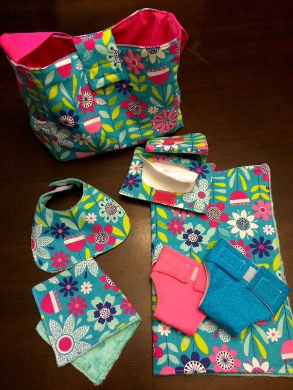 Baby doll diaper bag. Comes with two diapers burp cloth