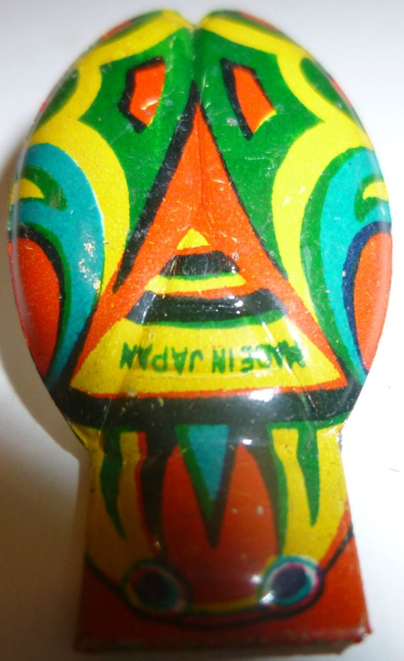 tin clicker toy