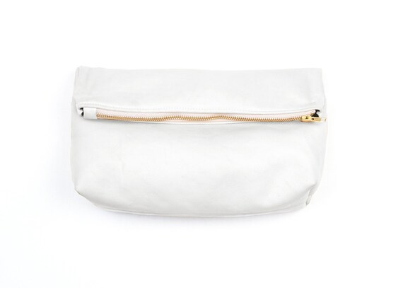 white round clutch bag