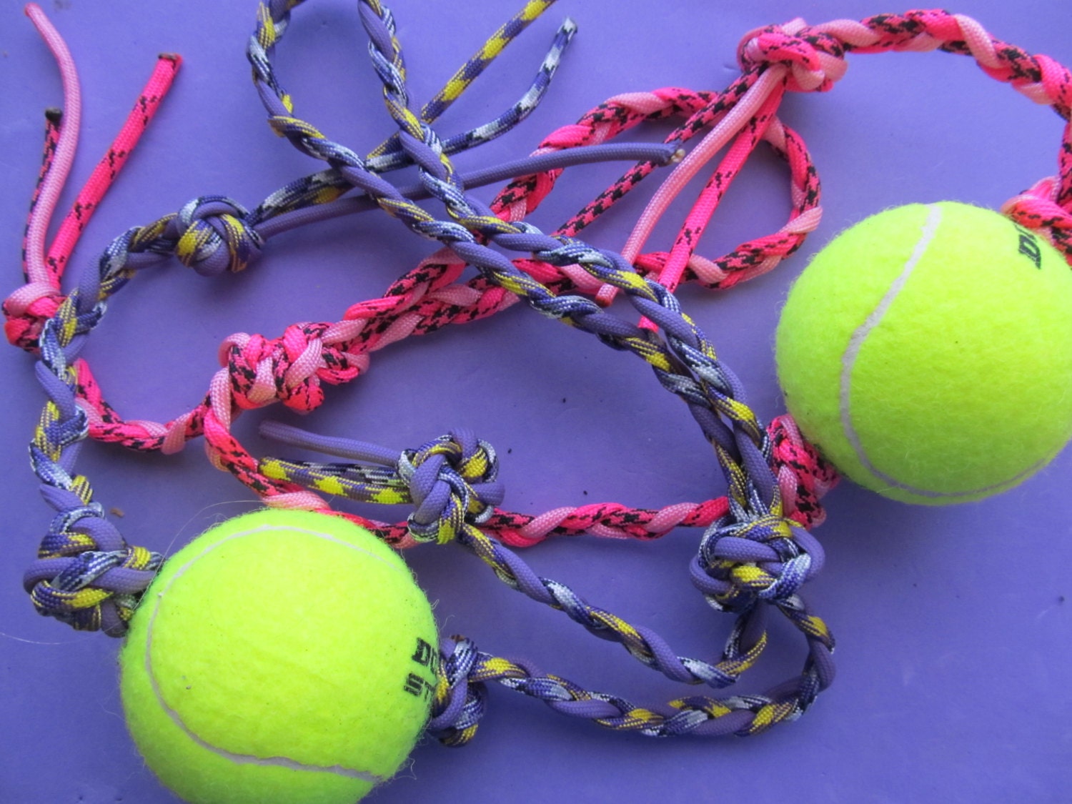 Dog toy made from tennis ball and braided paracord. Super