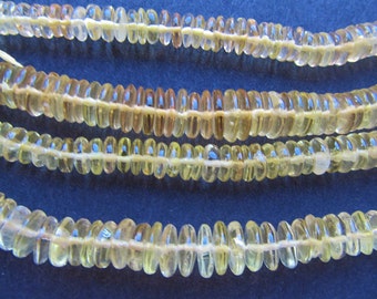 Beads: 16" gemstone strand - natural lemon quartz - 3x6mm to 5x18mm graduated heishi - translucent - pale yellow