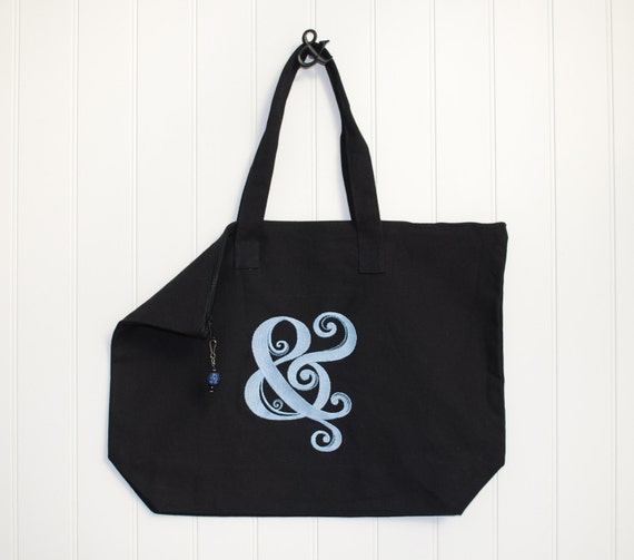 Zippered Black Canvas Tote Bag embroidered with a blue