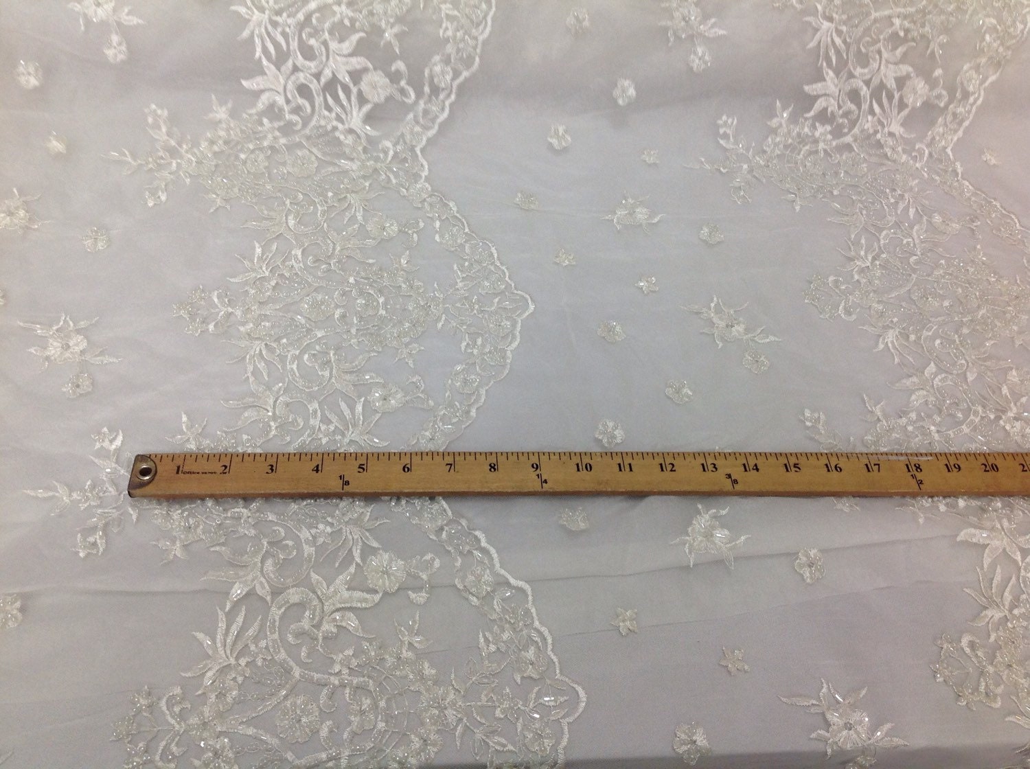 Bridal wedding beaded ivory mesh lace. Sold by the yard.