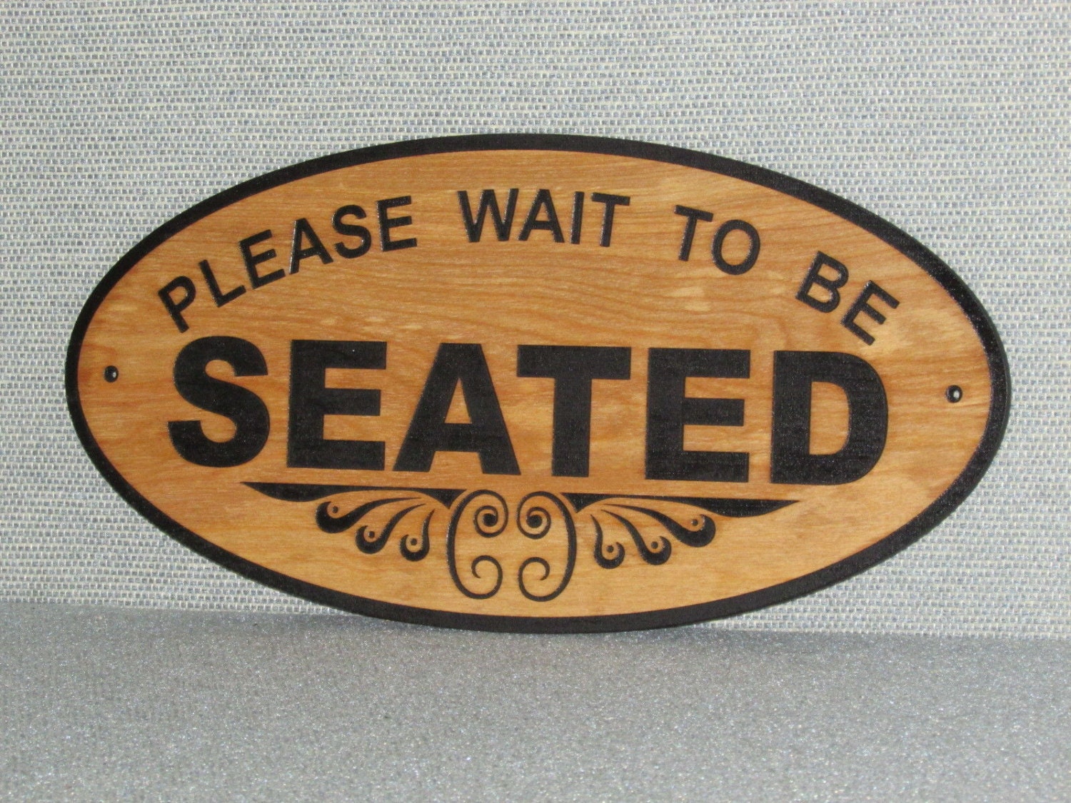 large-16-oval-wood-please-wait-to-be-seated-sign