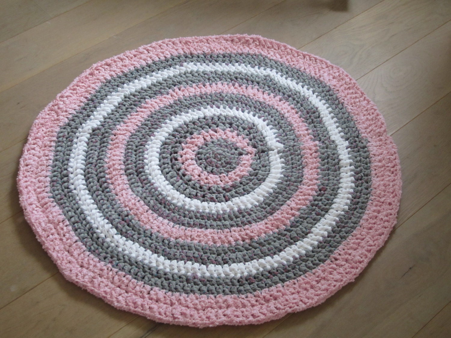 Pink round crocheted rug nursery rug zpagetti yarn rug