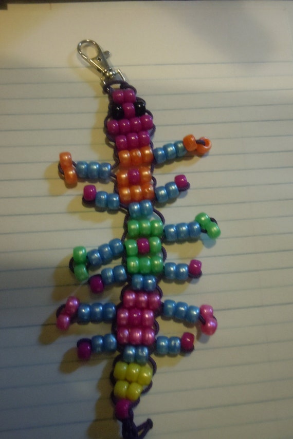 Rainbow Centipede made from purple paracord by BeadedHavenForever