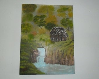 Log cabin near the waterfall