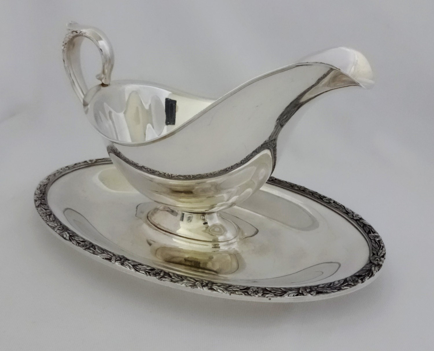 Vintage William Rogers silver plate gravy boat with attached drip platter in Primrose pattern