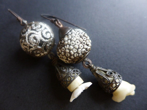 Fitzcarraldo.Rustic assemblage earrings with dark oxidation and flashes of white.