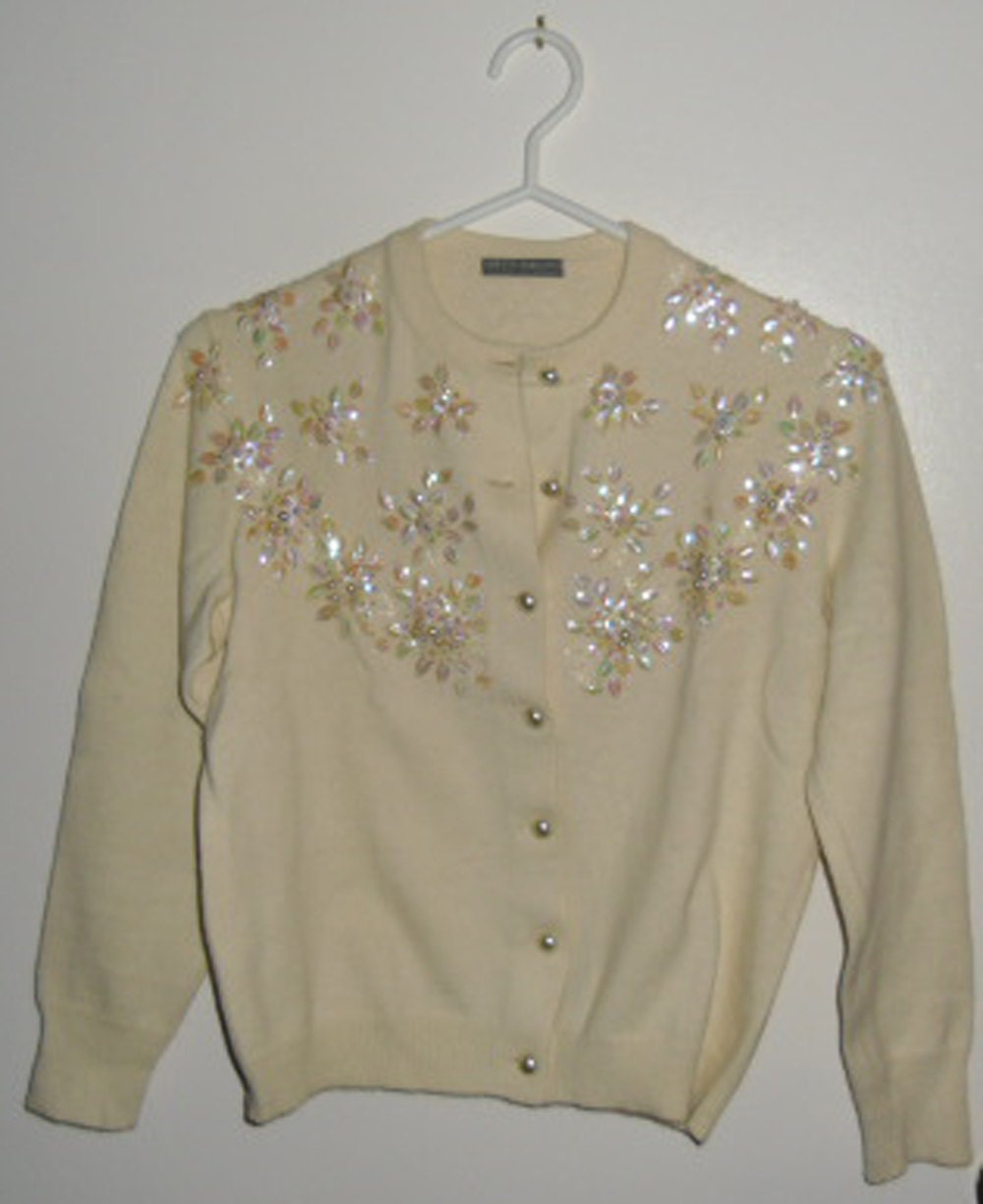 cream cardigan with pearls