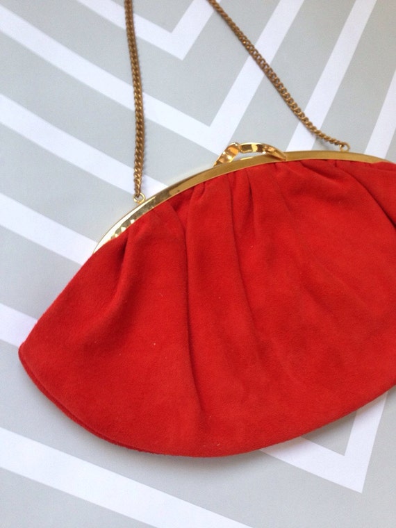 orange and gold clutch bag