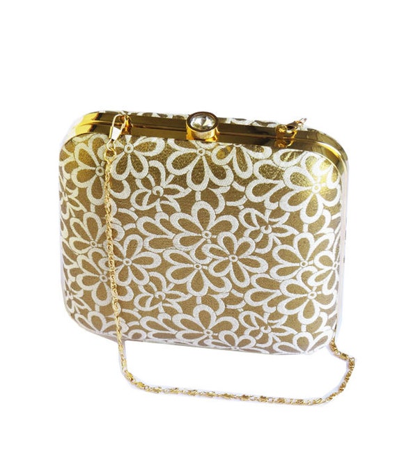 white clutch with gold