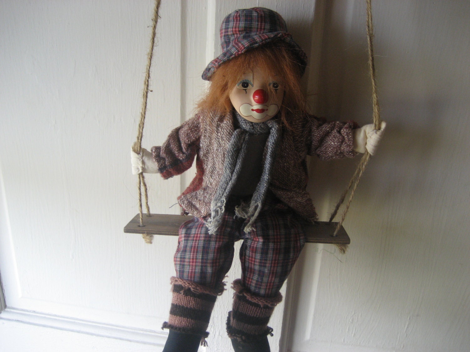 creepy doll on swing